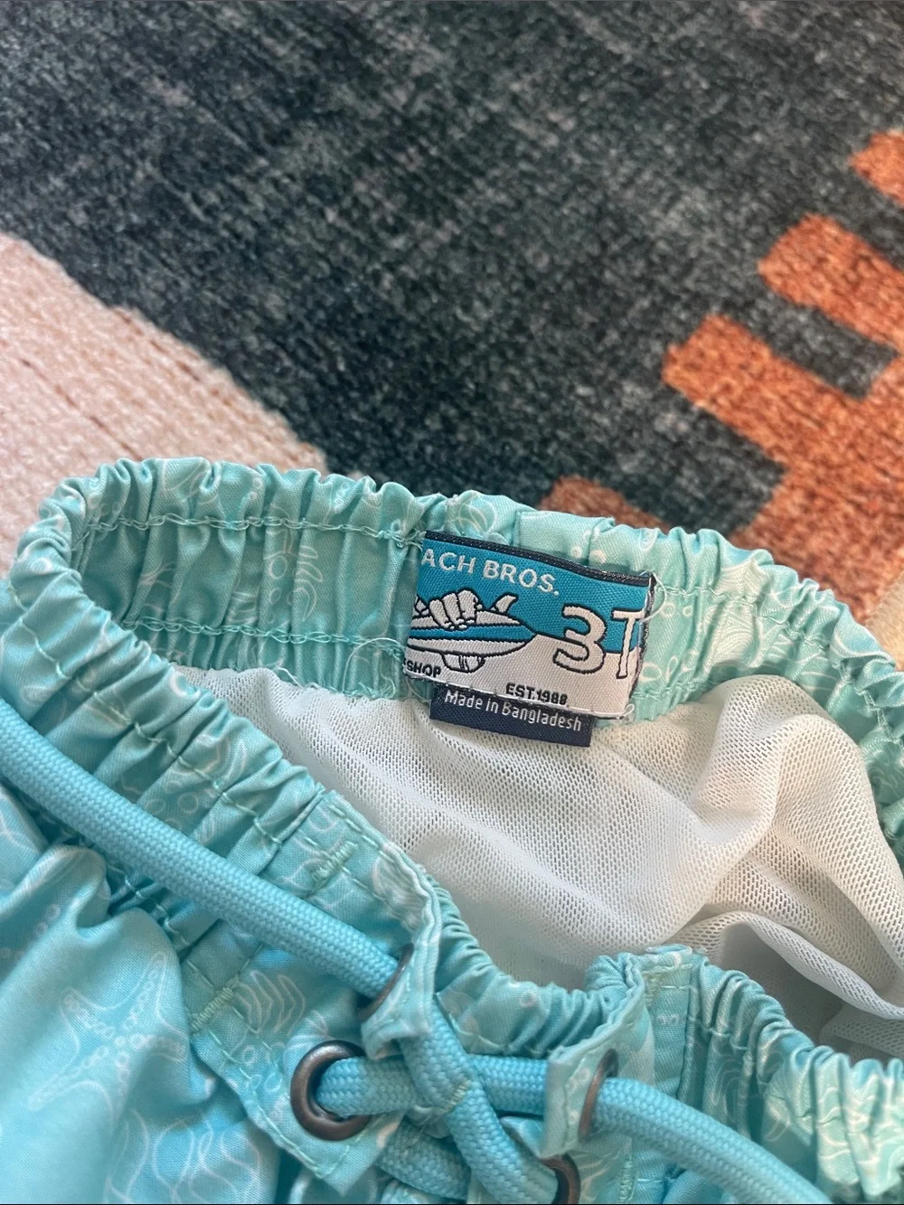 Light Aqua Kids Swim Trunks with Sea Print